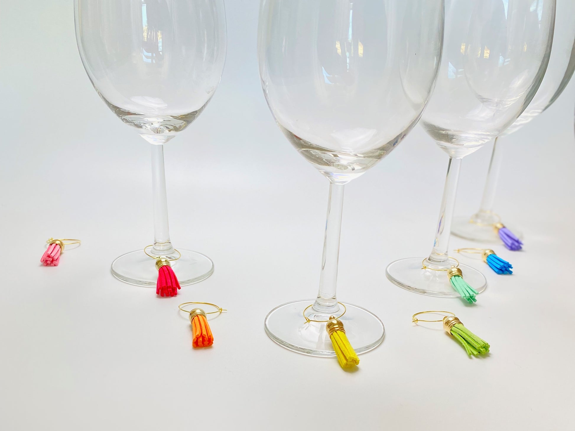 Faux leather rainbow wine charms on gold rings